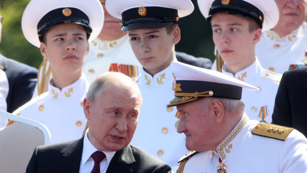 SAINT PETERSBURG, RUSSIA - JULY 30: (RUSSIA OUT) Russian President Vladimir Putin (L) talks to the Russian Navy's Commander-in-Chief Nikolai Yevmenov (R) during the annual Navy Day Parade on July 30, 2023, in Saint Petersburg, Russia. (Photo by Contributor/Getty Images)