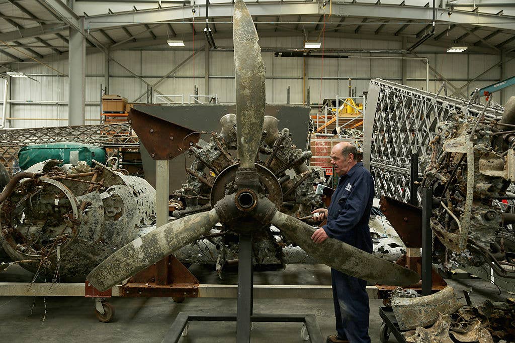 COSFORD, ENGLAND - JUNE 05:  Aircraft technician John Warburton continues the preservation work of a German World War II Dornier 17 aircraft at The Royal Air Force Museum Cosford, on June 5, 2015, Cosford, England. A salvage operation, planned through the RAF Museum, lifted the only remaining German bomber Dornier 17, used during the 'Battle of Britain' of 1940 from the sea on June 10, 2013. The plane is believed to be aircraft call-sign 5K-AR, shot down on August 26, 1940 at the height of the battle by RAF Boulton-Paul Defiant fighters.  (Photo by Christopher Furlong/Getty Images)