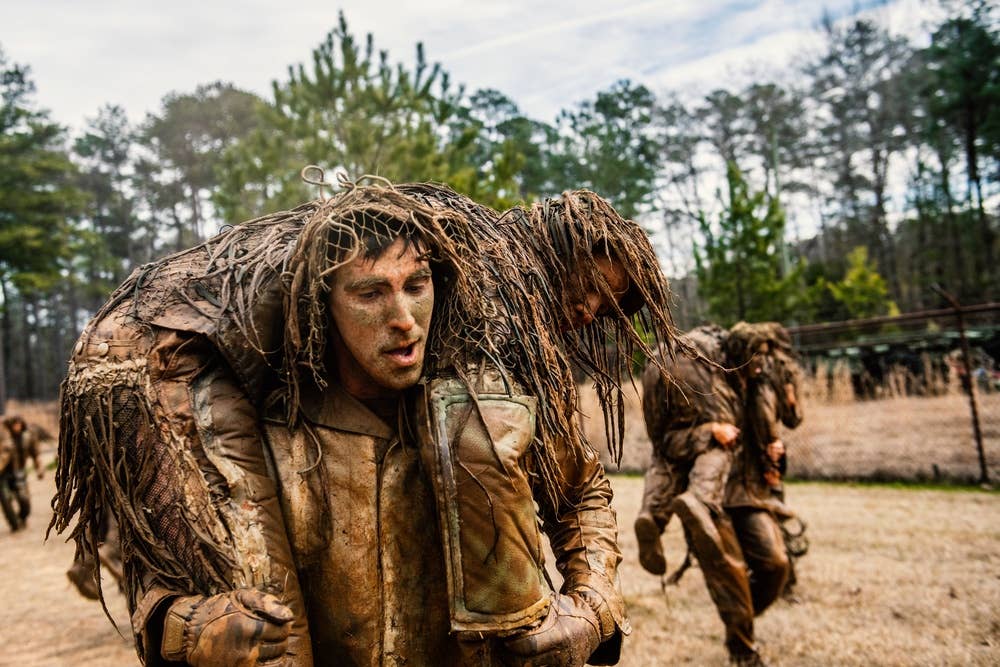 <em>The infamous ghillie wash tests the strength and durability of the suits and the students who wear them (U.S. Army)</em>