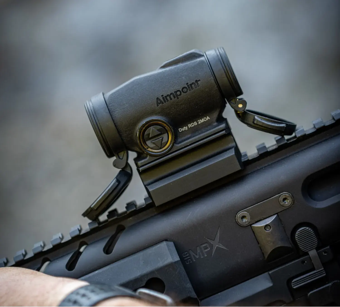 <em>The Duty RDS uses buttons to adjust brightness (Aimpoint)</em>