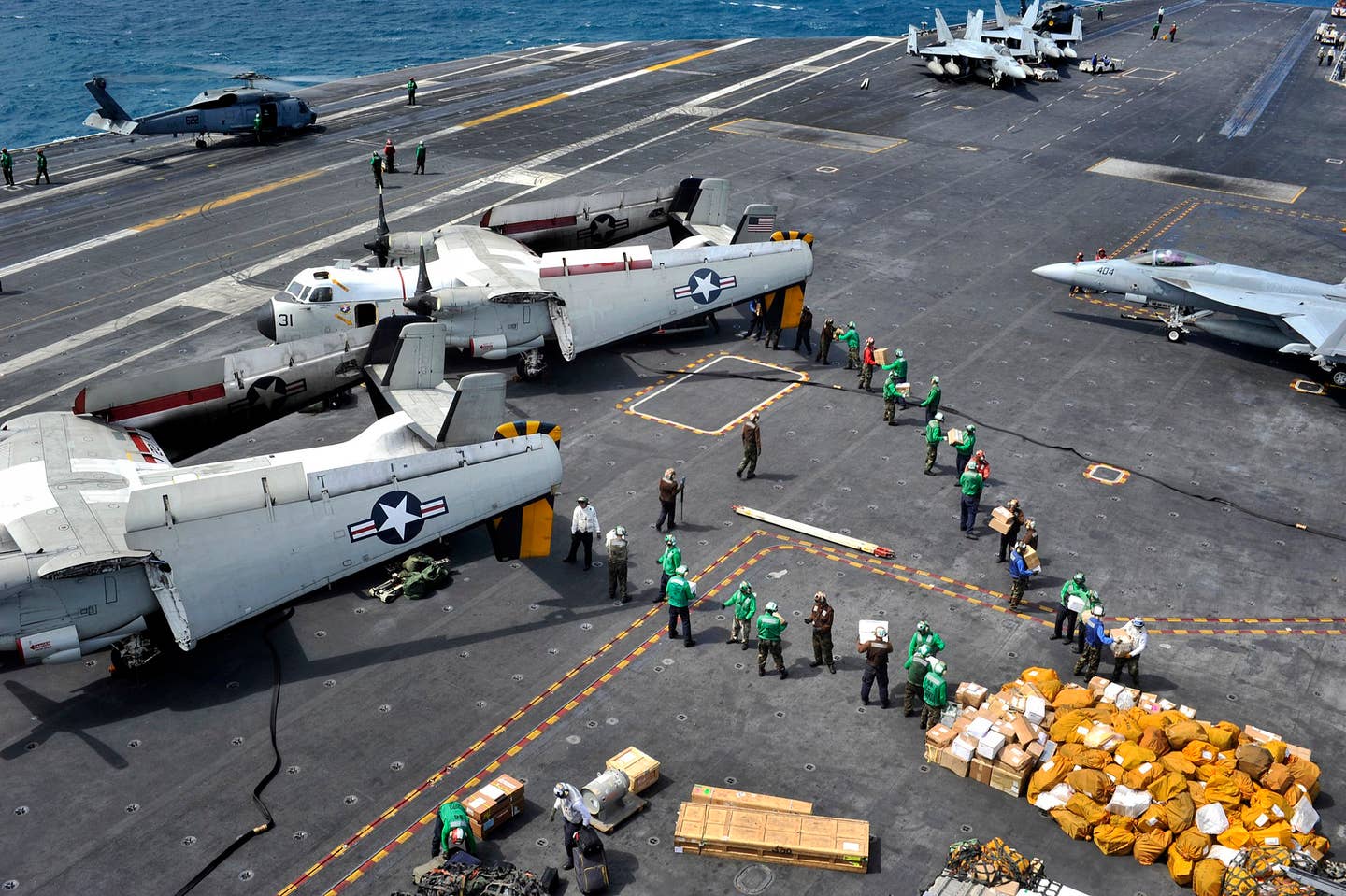 <em>Mail is unloaded from C-2As aboard USS </em>George Washington<em> (CVN-73) (U.S. Navy)</em>