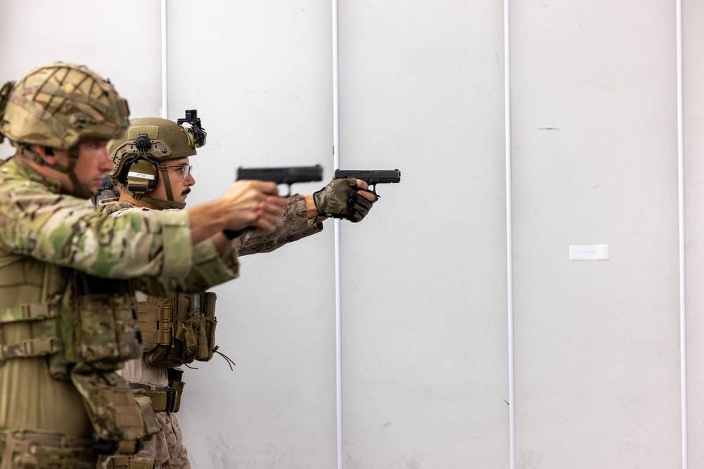 <em>U.S. Marines and British Royal Marine Commandos train on Glock 17s (U.S. Marine Corps)</em>
