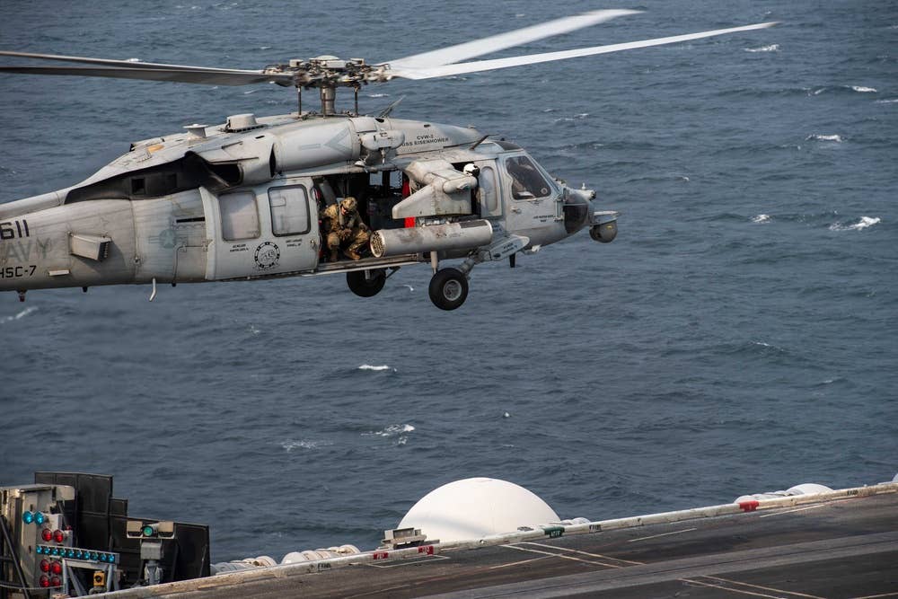 <em>An MH-60S Seahawk lands aboard USS </em>Eisenhower<em> (U.S. Navy)</em>