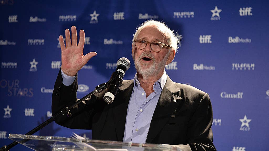 Norman Jewison speaks at a podium