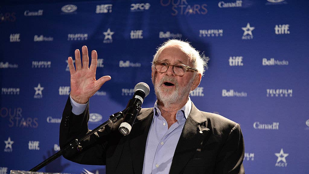 Norman Jewison speaks at a podium