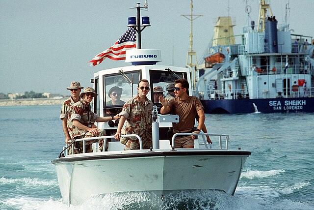 U.S. military on a patrol boat in the ocean during Operation Desert Shield.