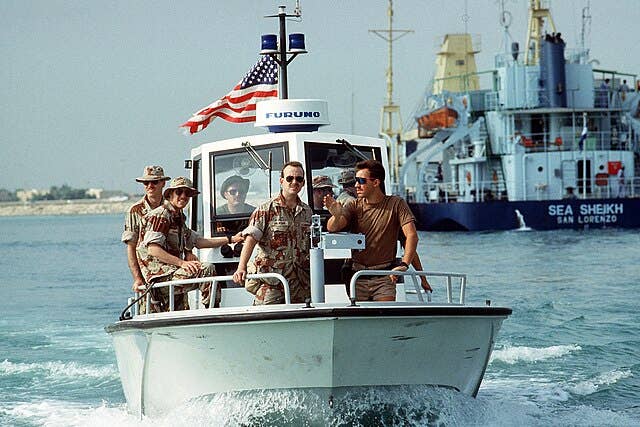 U.S. military on a patrol boat in the ocean during Operation Desert Shield.
