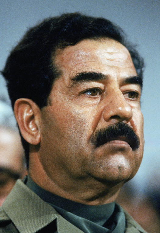 Saddam Hussein looks off camera