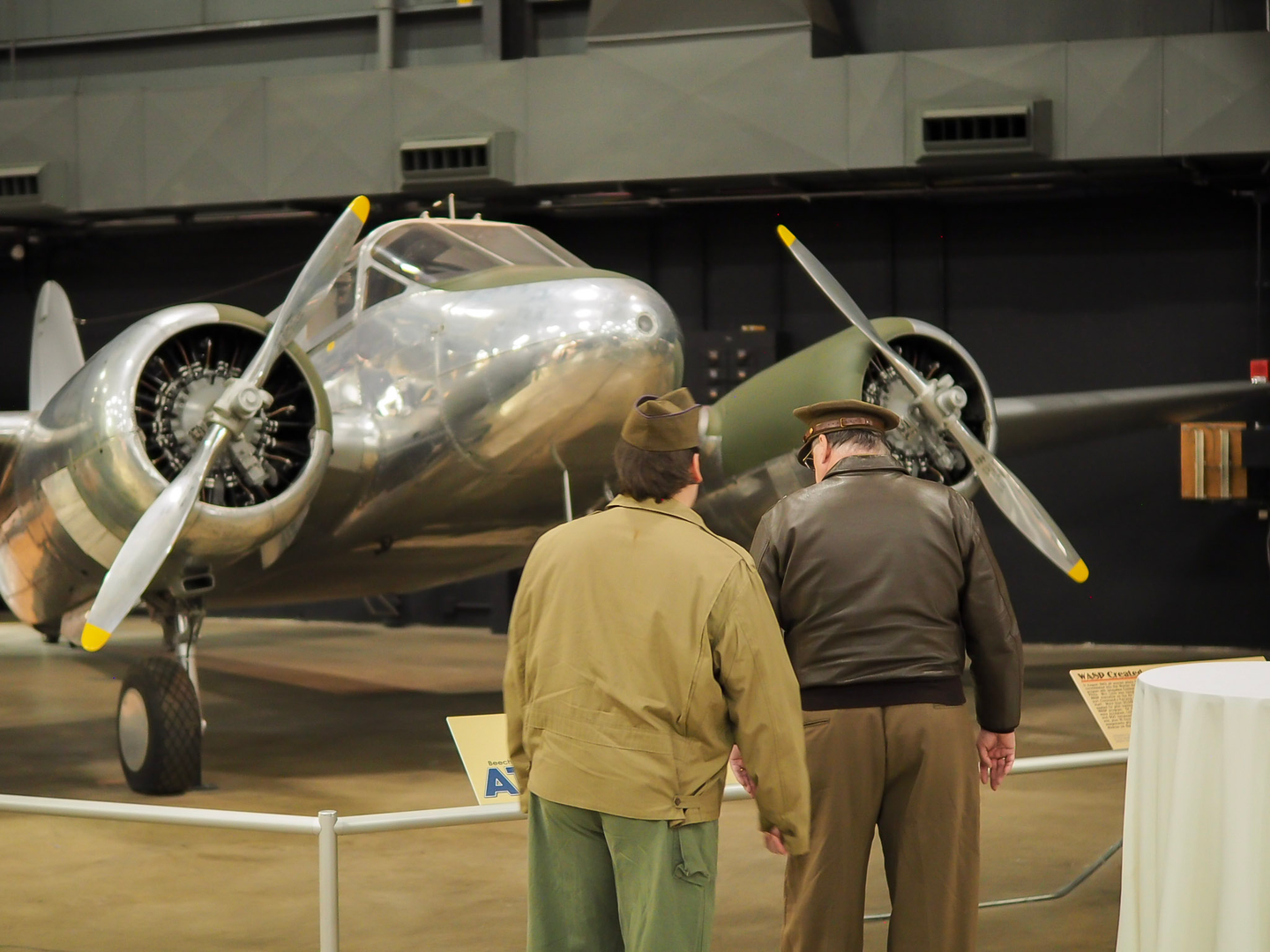 Viewers from the <em>Masters of the Air</em> exclusive screening take in one of the displays at the National Museum of the U.S. Air Force in Dayton, Ohio. Photo: Matthew VanEck for We Are The Mighty.