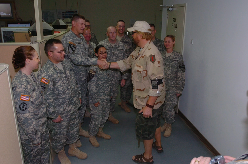 Toby Keith visited Soldiers in the Multi-National Division-Baghdad headquarters at Camp Liberty, Iraq, during his "Big Dog Daddy Tour." Keith took time to thank Soldiers for their service before performing a concert at Victory Base, an adjacent camp to Liberty. His tour also includes stops in Germany and Afghanistan. U.S. Army photo.