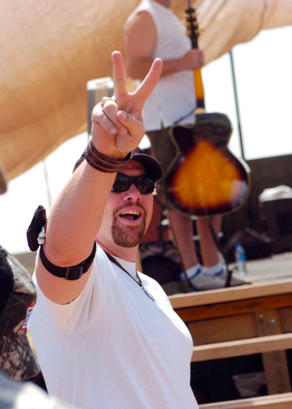 KIRKUK, Iraq (May 28, 2006) -- Country music star, Toby Keith, reacts to the crowd of Soldiers and Airmen at Forward Operating Base Warrior today. Keith spent the Memorial Day holiday traveling across Iraq to entertain service members.