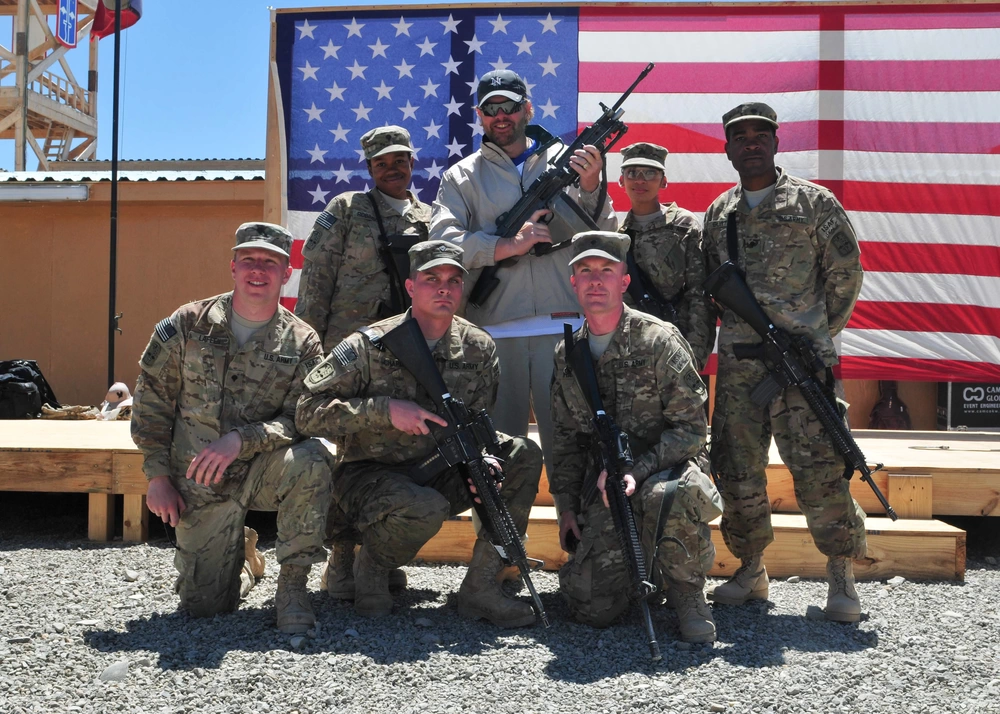 Toby Keith takes a moment to pose with service members in PAKTIKA PROVINCE,&nbsp;AFGHANISTAN, 2012. U.S. Army photo.