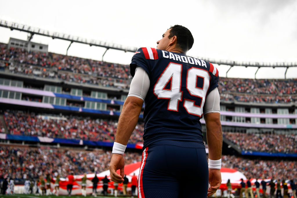 FOXBOROUGH, MASSACHUSETTS - NOVEMBER 06: Joe Cardona #49 of the New England Patriots looks on during the national anthem prior to playing the Indianapolis Colts at Gillette Stadium on November 06, 2022 in Foxborough, Massachusetts. (Photo by Billie Weiss/Getty Images)