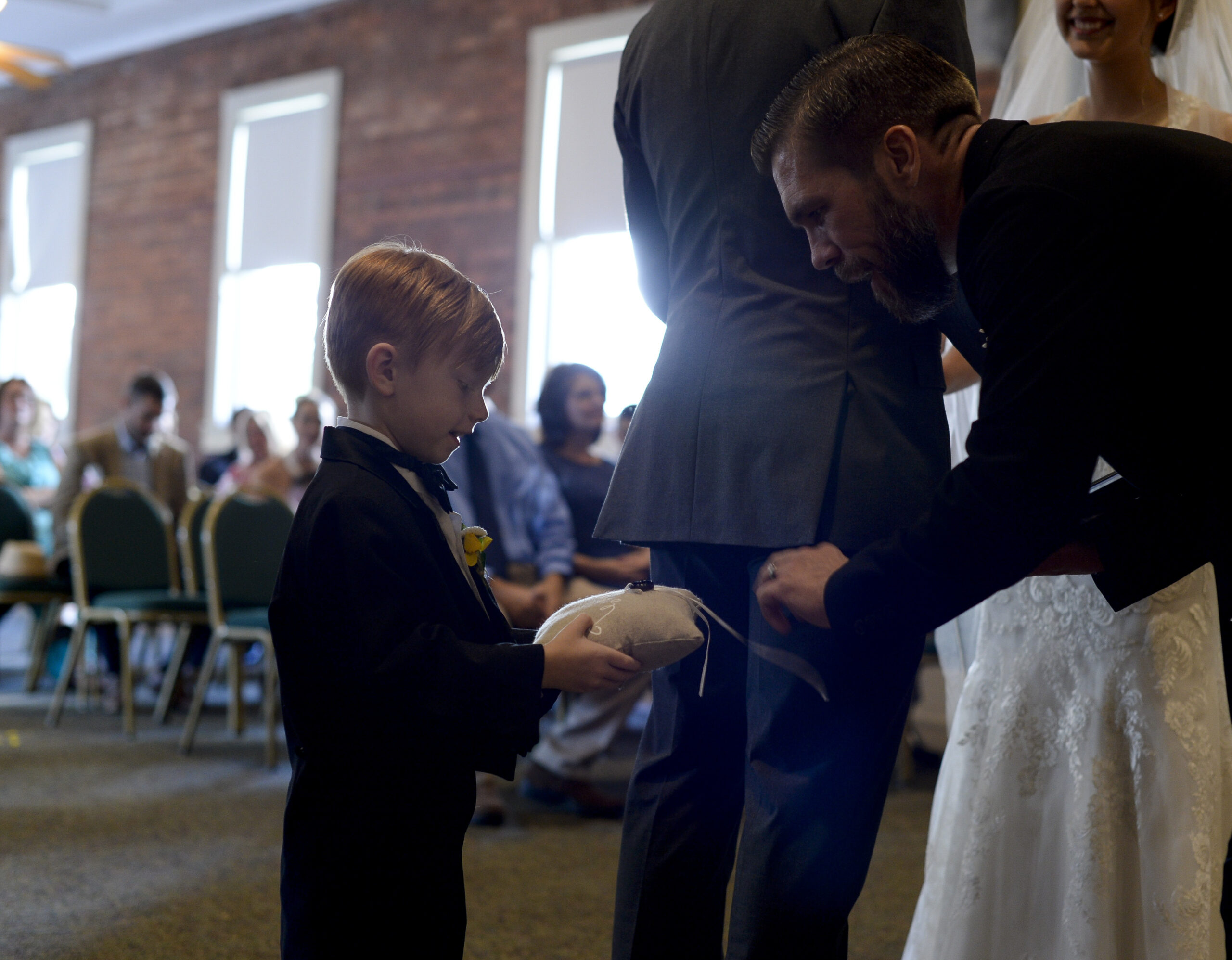 The ring bearer presents the rings to the Pastor at a wedding in Waycross, Georgia, July 2, 2017. The marriage between two military members was witnessed by friends and family. (U.S. Air Force photo by Airman 1st Class Kristen Heller)