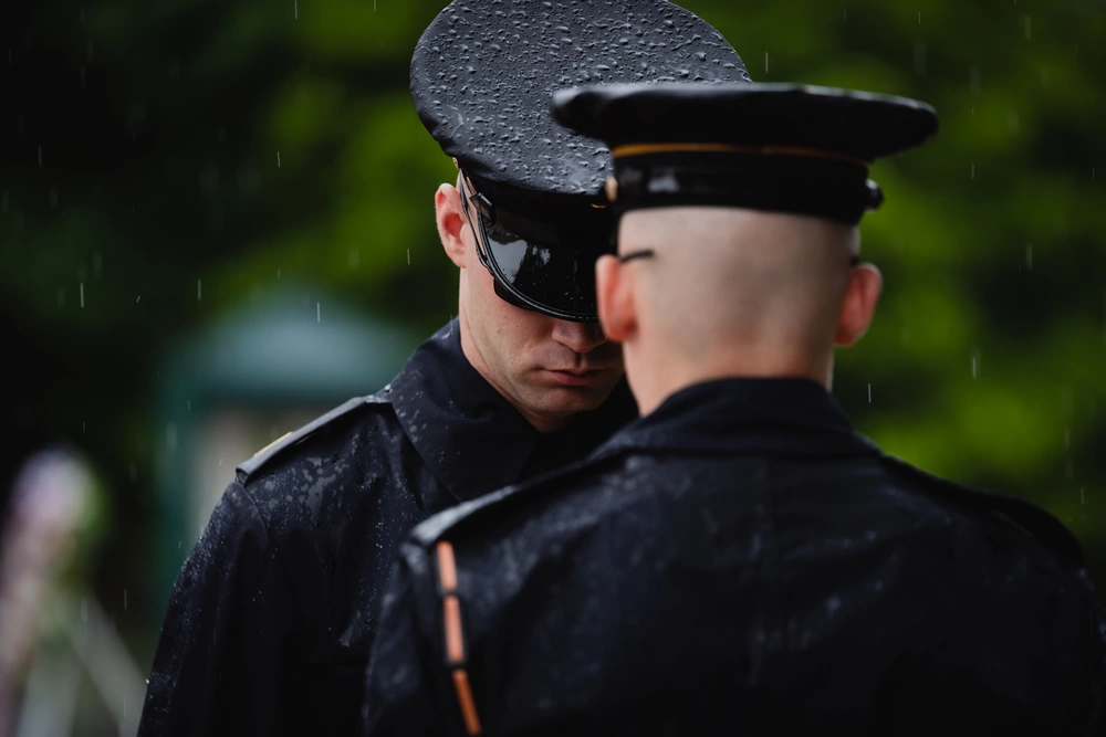 U.S. Army Staff Sgt. Taylor Uhler, left, and Spc. Ethan Shryock, tomb sentinels assigned to the 3d U.S. Infantry Regiment, “The Old Guard”, participate in a uniform inspection at the Tomb of the Unknown Soldier in Arlington, Virginia, April 22, 2023. Sentinels guard the Tomb at all hours of the day and in any weather condition. (U.S. Air Force photo by Senior Airman Joshua Hastings)