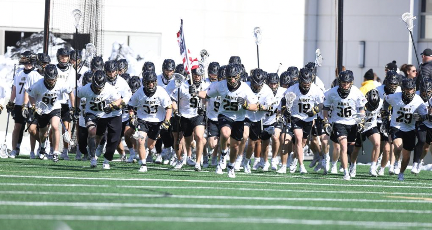 Army lacrosse runs onto the field