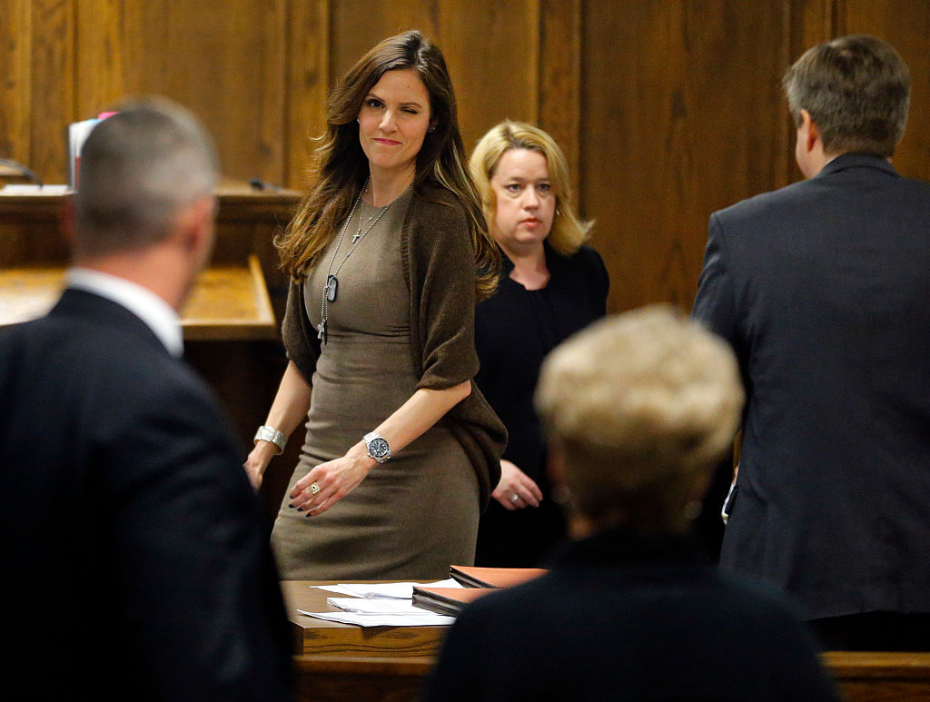 Taya Kyle in a courtroom during her husband's murder trial, winks at the parents of Chris Littlefield, the other man killed alongside Chris Kyle, the American Sniper.