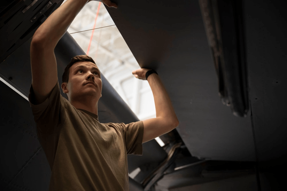 Staff Sgt. Jacob Alvarado, 22nd Maintenance Squadron repair and reclamation journeyman, works on an aircraft at McConnell Air Force Base, Kansas, March 12, 2024. Alvarado was a part of a volunteer team to fix 'Doc', a B-29 bomber. (U.S. Air Force photo by Airman Paula Arce)