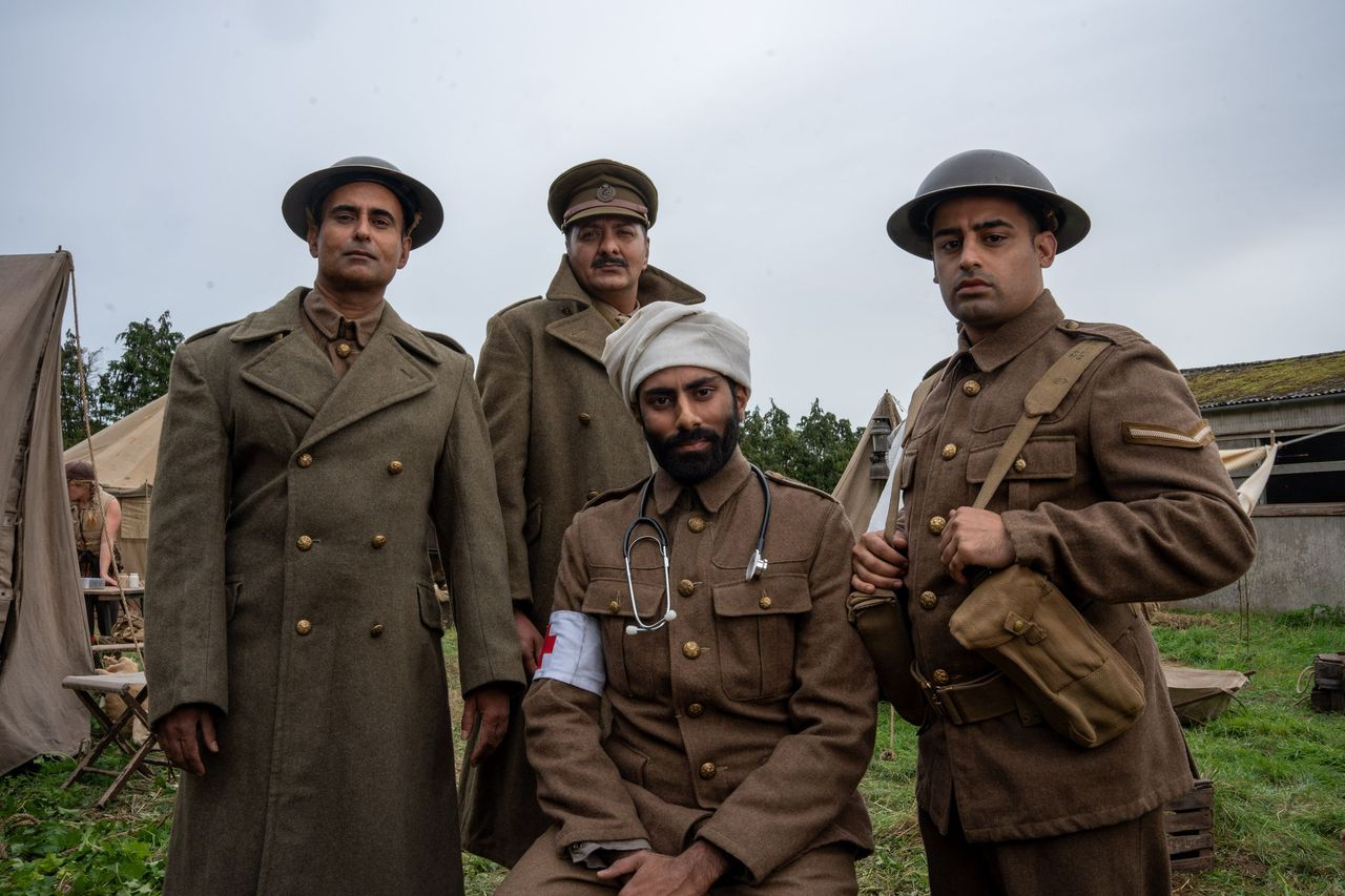 <br>(L to R) Actors Shammi Aulakh, Jack Gill, Rishi Rian and Ali Afzal, portraying Captain Anis Khan, Major Akbar Khan, Medic Saddiq Khan, and Corporal Chaudry Wali Mohammed, respectively, pose for a group portrait outdoors while filming a WW2 historic reenactment production for "Erased: WW2's Heroes of Color." They were members of Force K6, a little-known Indian regiment of mule handlers in WW2. Amidst the chaos of Dunkirk and the advancing German Army, the Indian regiment fought for victory and independence. (National Geographic/Harriet<br>Laws Herd)