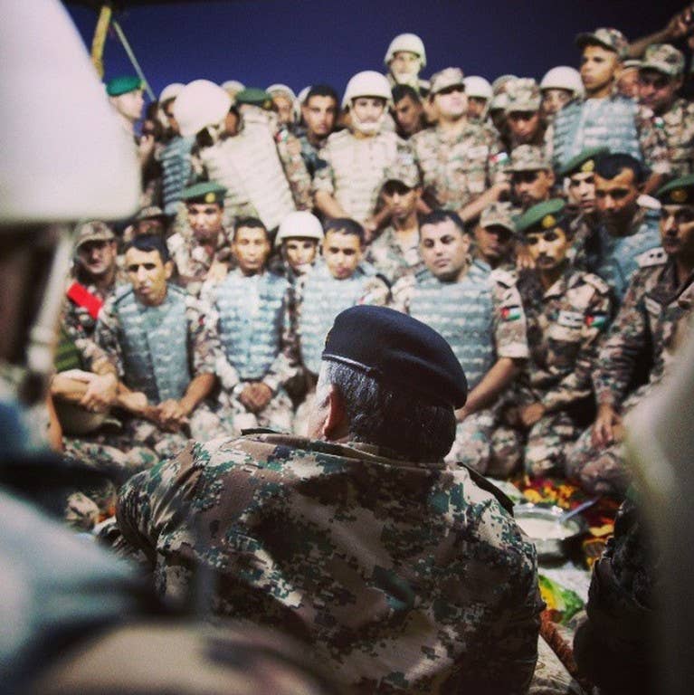 Abdullah speaking with soldiers after sharing a meal. (Photo: The Royal Hashemite Court/Instagram)