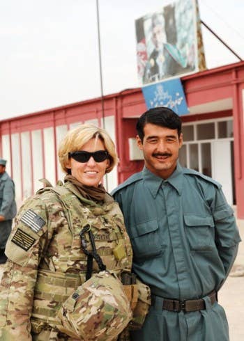 Forsythe in Afghanistan in 2013 with a member of the Afghan National Police.