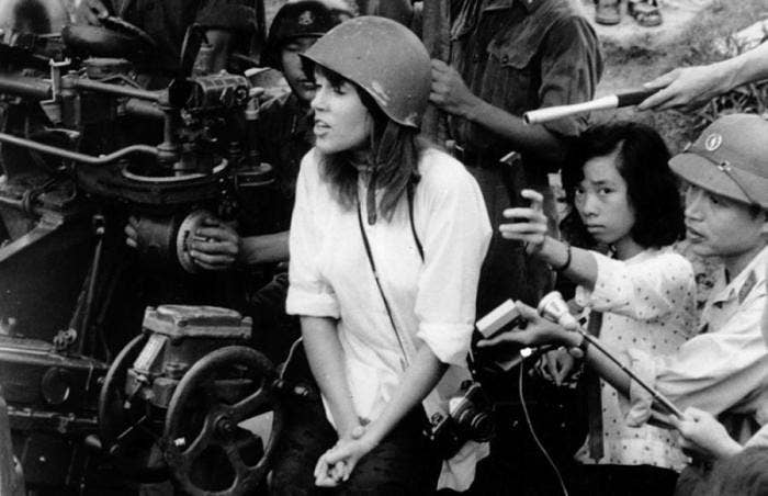 Jane Fonda sitting on an anti-aircraft gun during her visit to Hanoi in April 1972. (File photo)