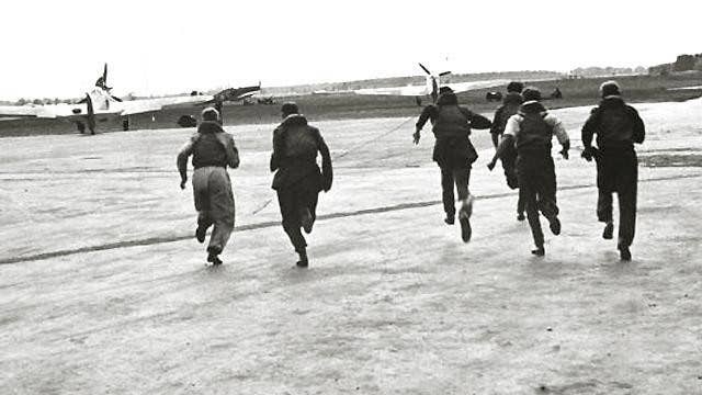 RAF pilots scramble to their fighters during the Battle of Britain.