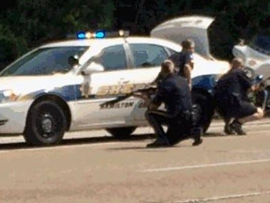 In this image made from video and released by WRCB-TV, authorities work an active shooting scene on Amincola Highway near the Naval Reserve Center, in Chattanooga, Tenn. on July 16, 2015. (Photo: WRCB-TV via AP)