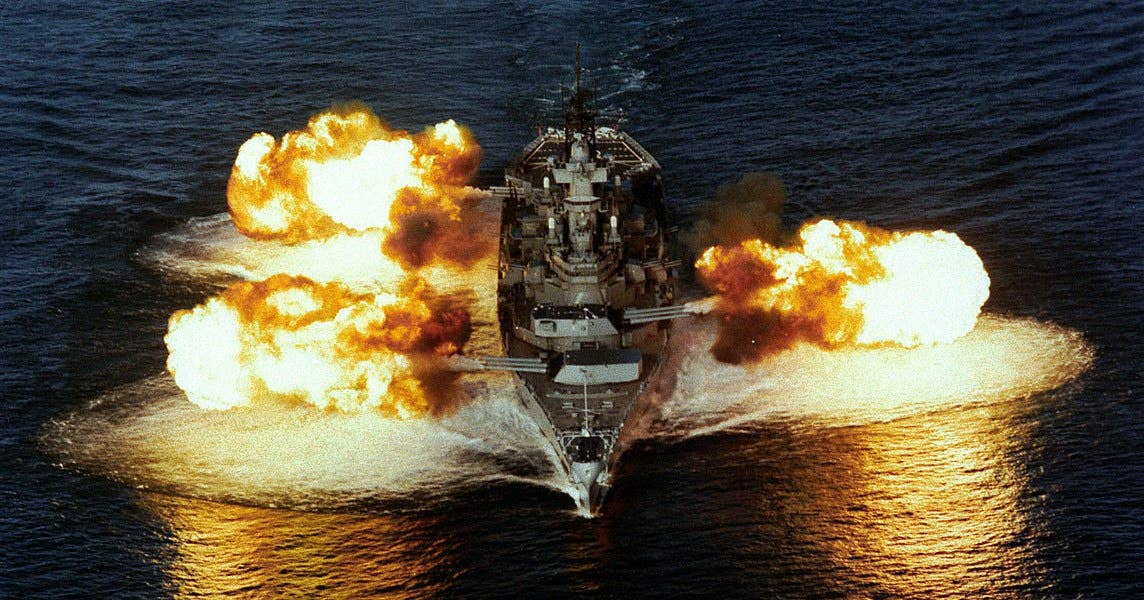 USS New Jersey (BB 62) fires her main guns. (Photo: US Navy)