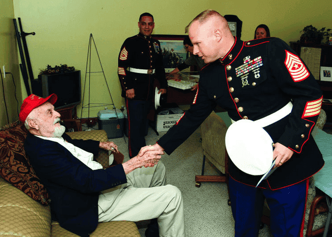 Marines greet John Keith Wells on his 91st birthday. (Photo: Arvada Press)