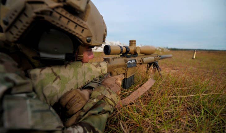 An Army Special Forces soldier fires an M110 semi-automatic sniper system on Eglin Range,Fla., Oct. 30, 2013. (U.S. Air Force Photo/Staff Sgt. John Bainter)