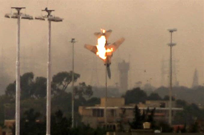 Libya MiG-23 goes down in flames after being hit by rebel fire. (Photo: aljazeera.com)