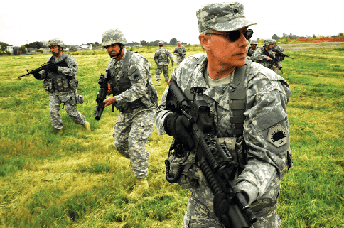 Members of the California State Military Reserve perform squad drills.