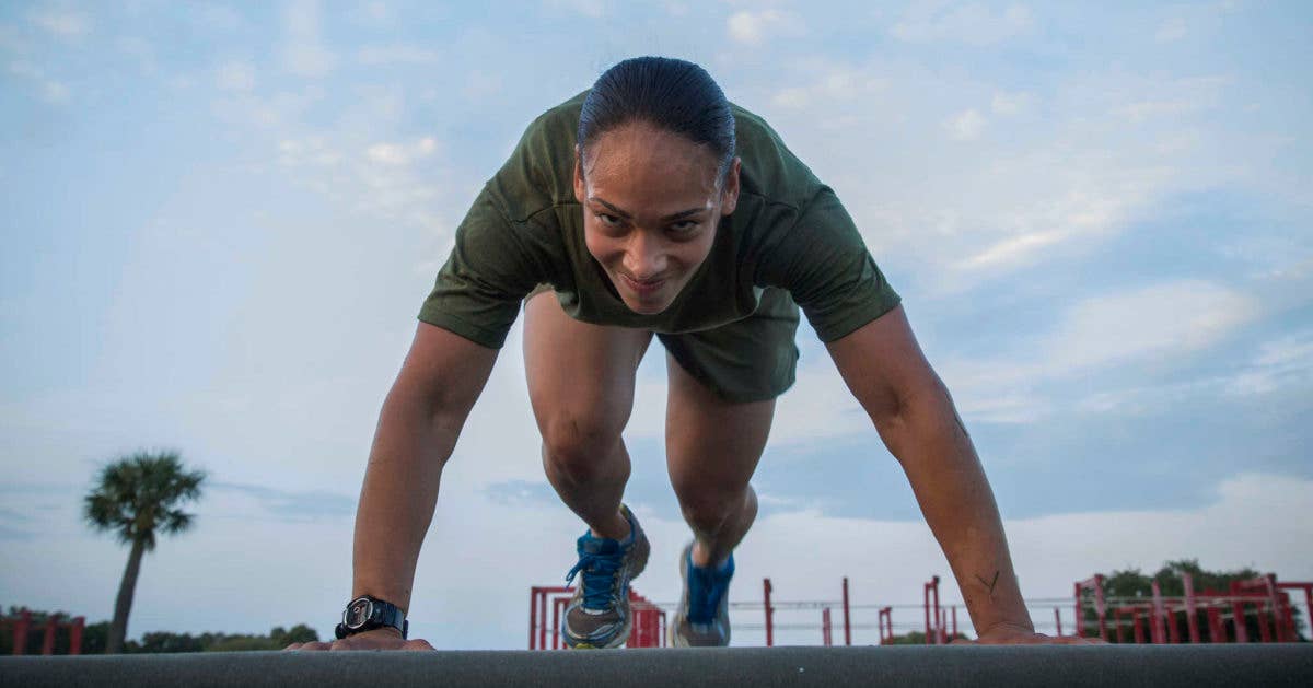A Marine with Headquarters Company, Headquarters and Service Battalion, performs mountain climbers during Battalion physical training on Parris Island, S.C., June 15, 2016. US Marine Corps photo by Lance Cpl. Mackenzie B. Carter