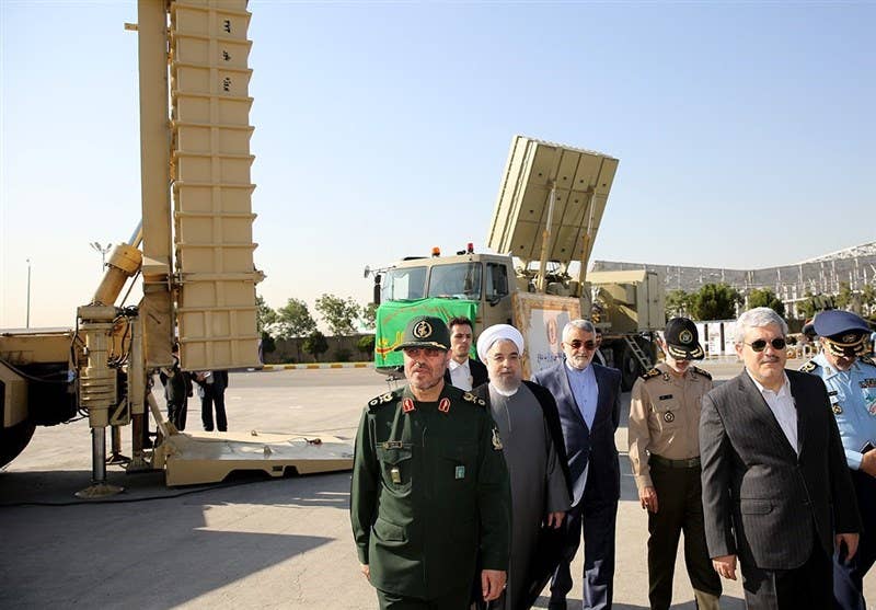 Iranian President Hassan Rouhani joins Defense Ministry officials at the unveiling of the Bavar 373 SAM system. (Photo: Tasnim)