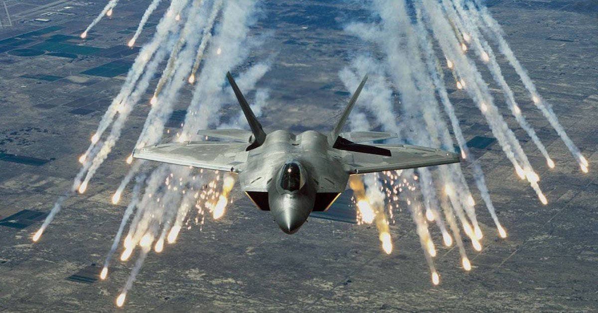 An F-22 deploys flares. | US Air Force photo