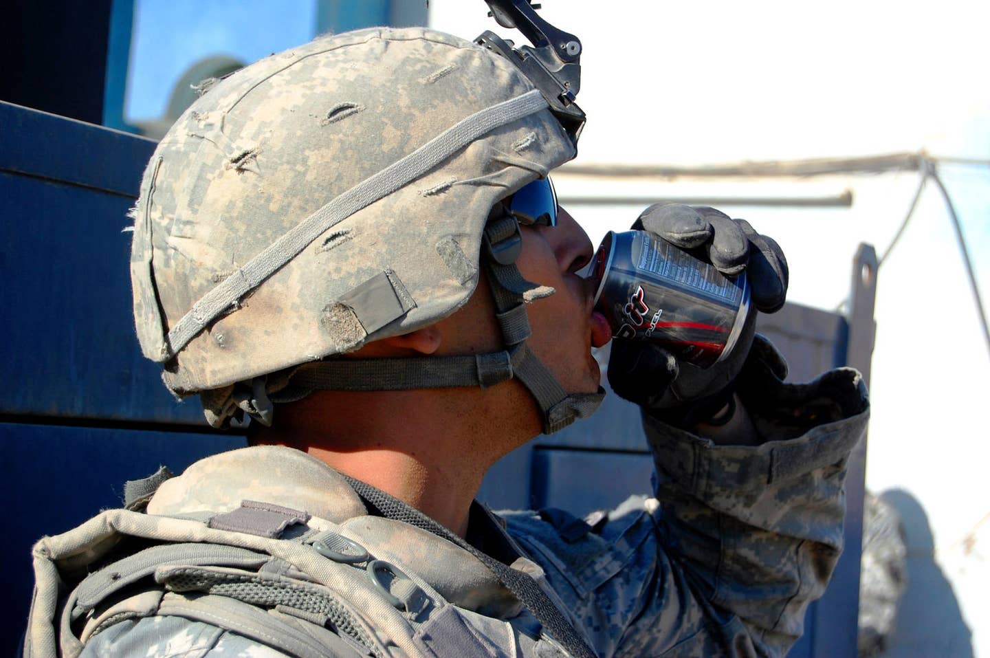 Spc. Kyle Lauth, assigned to Alpha Company, 1st Battalion, 27th Infantry Regiment, sips an energy drink before a dismounted patrol through the Hussainiyah town of the Istaqlal Qada district northeast of Baghdad, Dec. 29, 2008. (Army photo by Sgt. 1st Class JB Jaso)