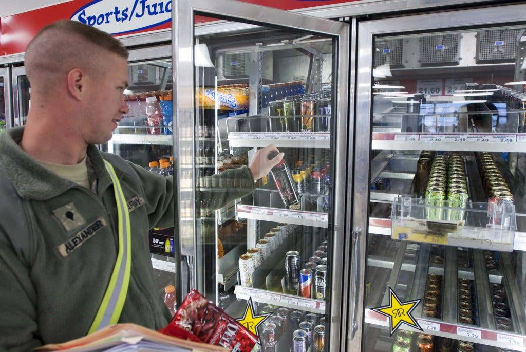 Spc. Kevin Alexander of 138th Quartermaster Company grabs an energy drink at the Camp Atterbury Post Exchange. Most energy drinks contain anywhere from 70 to 200 milligrams of caffeine. The daily recommended intake of caffeine is no more than 300 milligrams. (Army photo by Sgt. David Bruce)