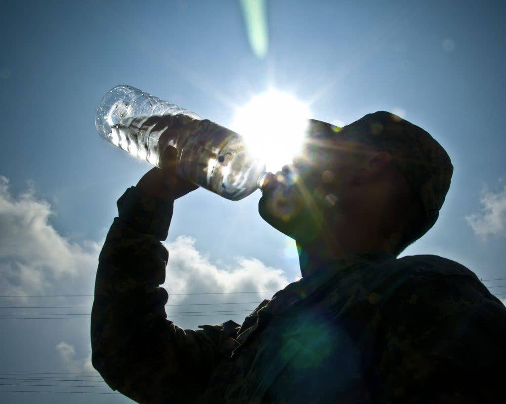 Dehydration is caused by not drinking enough water. The amount of water necessary to keep someone hydrated depends greatly on the weather, the amount of physical activity, and an individual's physical fitness level. The symptoms of dehydration include lethargy, headaches and lack of energy. (Army photo by Sgt. Timothy R. Koster)