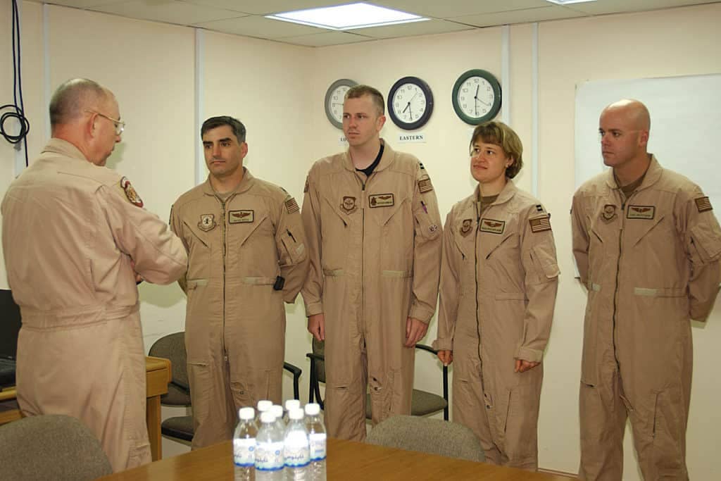 Lt General T. Michael Moseley presents Paulsen-Howe and her crew members the Distinguished Flying Cross. (U.S. Air Force photo by Airman Bridget Rapp)