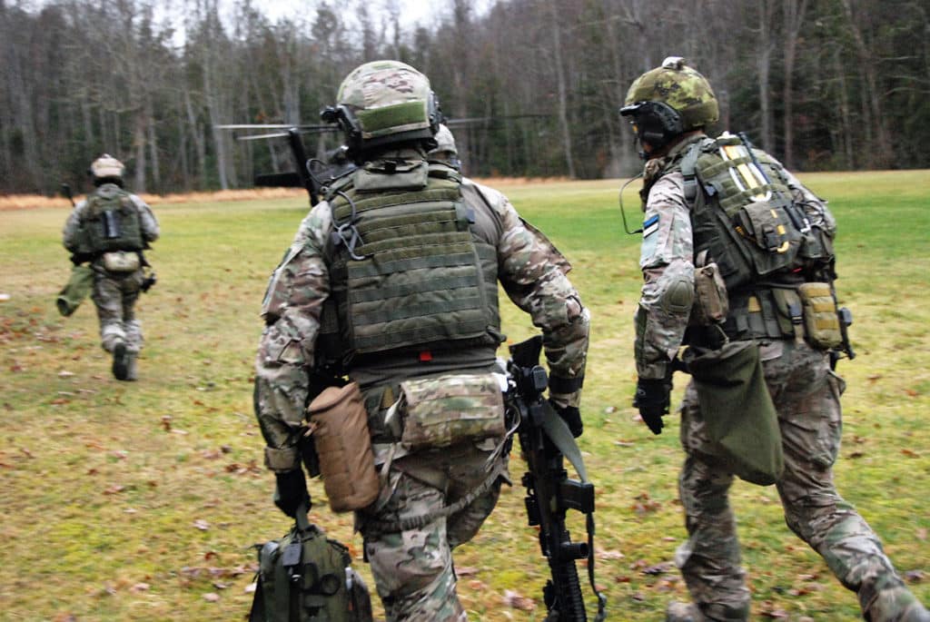 Estonian Special Operations Force soldiers, along with U.S. Army Special Operations Forces Soldiers with 10th Special Forces Group (Airborne) and soldiers of the West Virginia National Guard, quickly move toward an aircraft for exfiltration during an air-assault training exercise as part of Exercise Ridge Runner Feb. 23, 2017 in West Virginia. (U.S. Army photo by Sgt. 1st Class Jeff Smith)