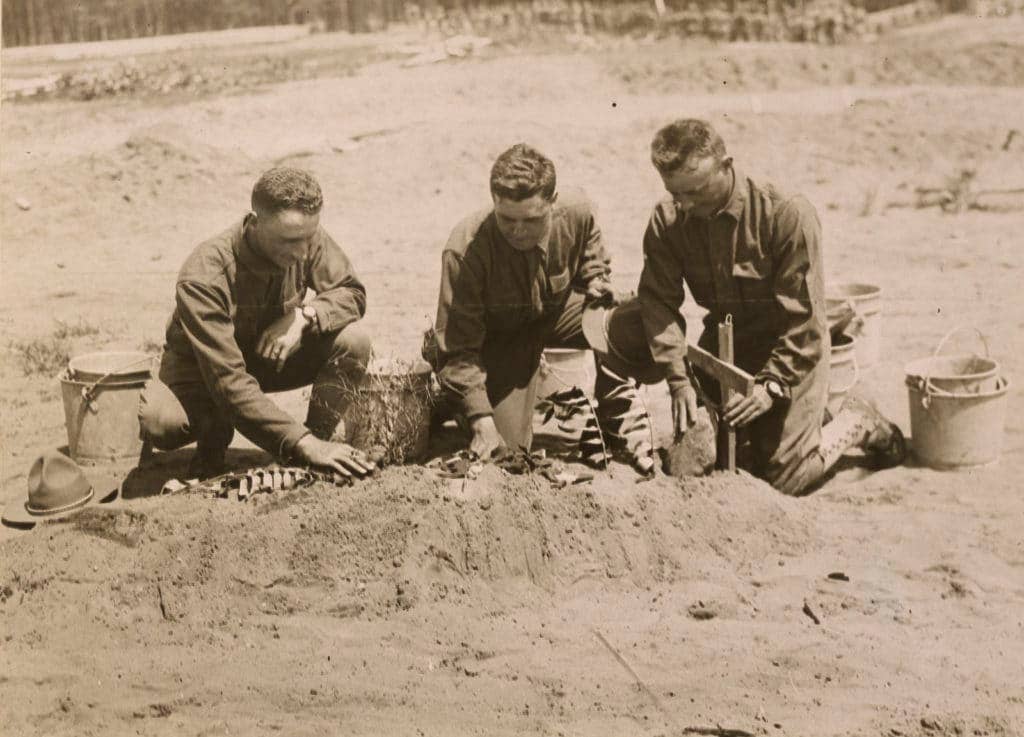 Soldiers in a training camp at Plattsburg, New York, show off the grave they created for a dummy of the German kaiser during training on trench construction. (Photo: National Archives and Records Administration)