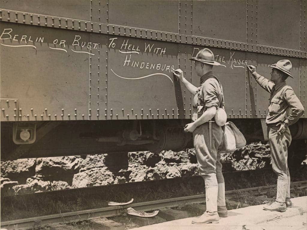 Engineers ready to ship out write motivational messages on the side of their train car just before they leave the Atlanta, Georgia, area for France. (Photo: National Archives and Records Administration)