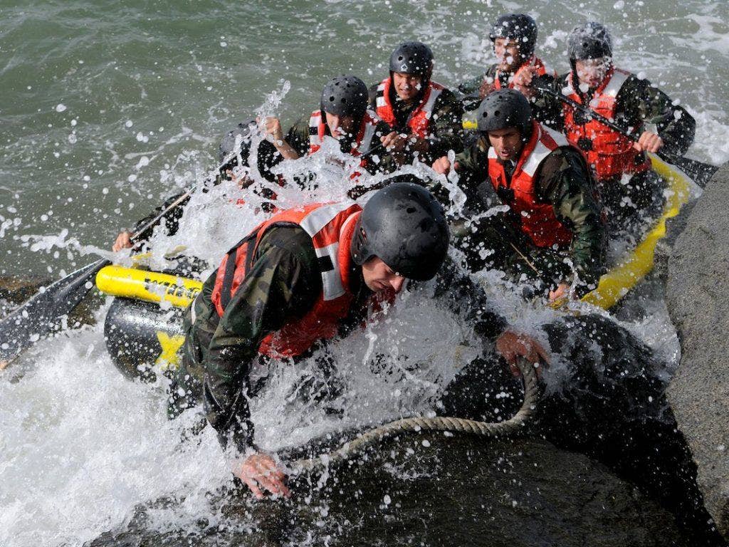 Students assigned to Basic Underwater Demolition/SEAL class 282 participate in Rock Portage at Coronado Island in 2010. | Seaman Kyle Gahlau/Navy Visual News Service via Flickr