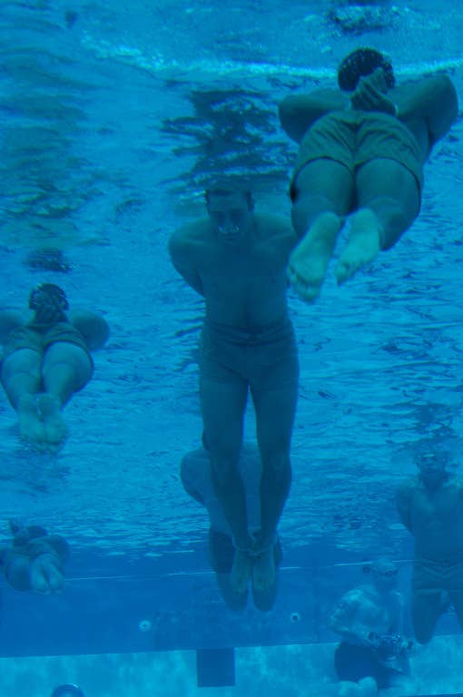 Basic Underwater Demolition/Seals students swim 100 meters with bound hands and feet as part of their first-phase swimming test. The test is used as a tool to examine how comfortable each student feels underwater. (U.S. Navy photo by Mass Communication Specialist 2nd Class Shauntae Hinkle)