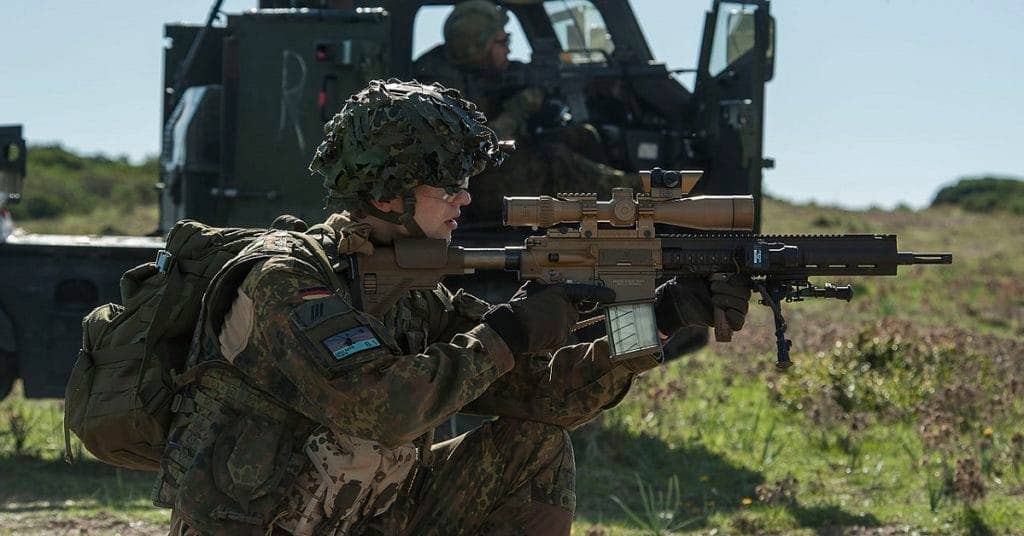 A German soldier fires a Heckler  Koch G28 during a NATO exercise. (NATO photo by Alessio Ventura)