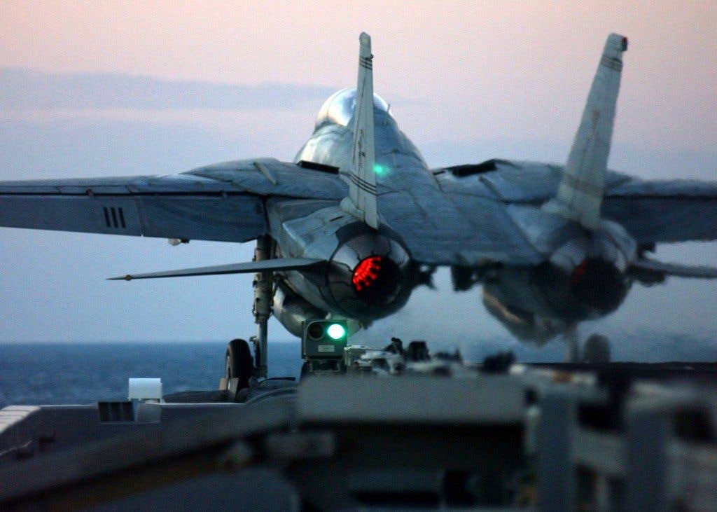 An F-14B Tomcat is catapulted from the flight deck of the aircraft carrier USS Harry S. Truman (CVN 75) during evening flight operations in the Persian Gulf on Dec. 4, 2004. DoD photo by Airman Kristopher Wilson, U.S. Navy. (Released)