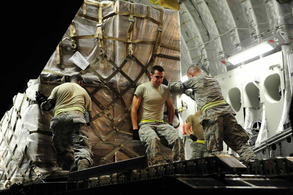 U.S. Airmen load pallets of nonlethal aid for the Syrian Opposition Coalition onto a C-17 Globemaster III aircraft at an undisclosed base May 9, 2013. U.S. forces provided humanitarian aid to refugees of the Syrian civil war. (Dept. of Defense photo by Staff Sgt. Nicole Manzanares, U.S. Air Force)