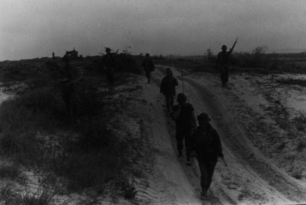 A patrol of Vietnamese Popular Forces and U.S. Marines of Combined Action Program, 3rd Marines, 3rd Regiment and 3rd Battalion, move out across dunes bordering Quang Xuyen village to the south of Danang on March 28, 1970. (Photo: U.S. Marine Corps Sgt. H.M. Smith)