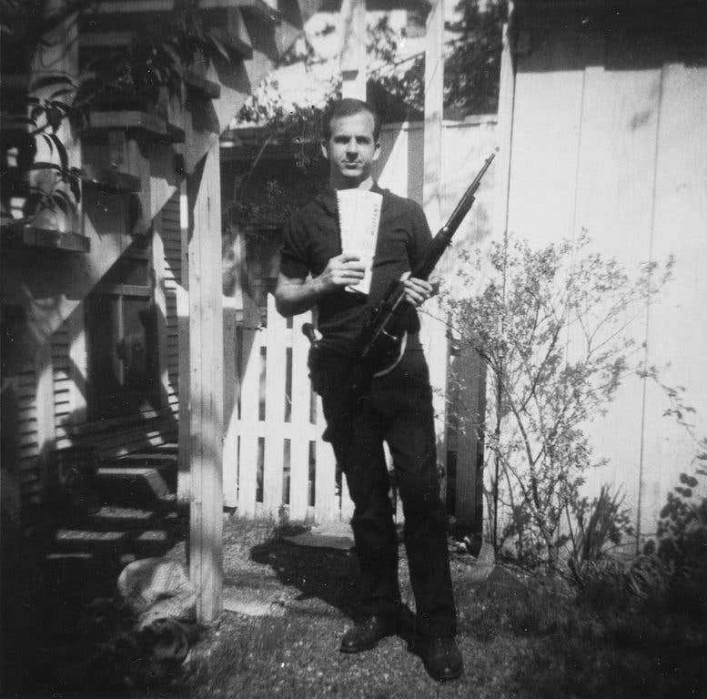 Photo of Lee Harvey Oswald with rifle, taken in Oswald's back yard, Neely Street, Dallas Texas, March 1963. (Photo released by the Warren Commission)